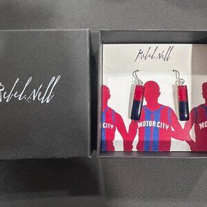 Rebel Nell unique red and blue earrings made from Detroit Pistons’ jerseys.